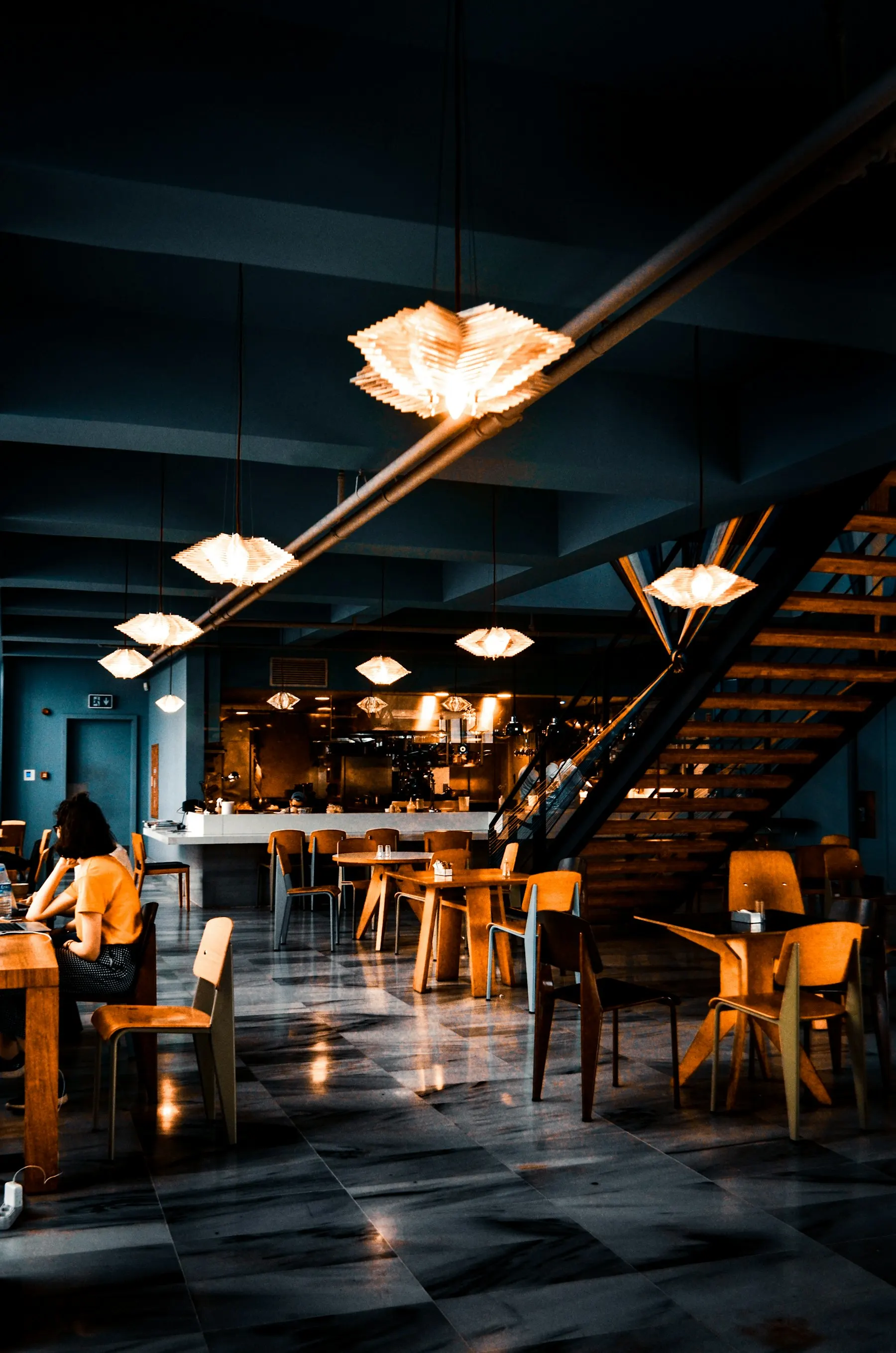 Restaurant dining room in the evening with warm lights